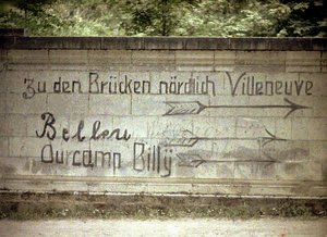 German and English inscriptions on a wall, Soissons, Aisne, France by Fernand Cuville